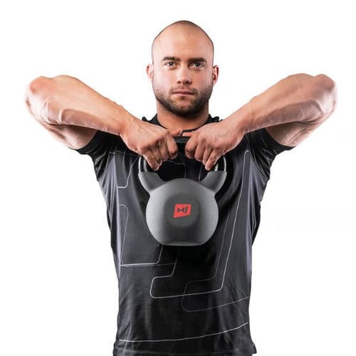 Man performing upright row with Hop-Sport kettlebell, elbows lifted high