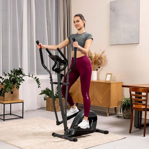 Woman working out for weight loss on a Hop-Sport cross trainer indoor