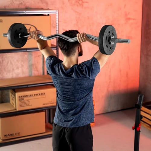 Man lifting a Hop-Sport barbell with an EZ curl bar behind head, targeting fat loss through resistance training