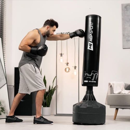 Man boxing with a Hop-Sport free-standing punch bag during a home gym workout