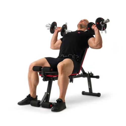 Man performing incline bench press with dumbbells on black Hop-Sport weight bench