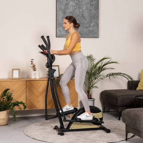 Woman using a Hop-Sport cross trainer in a home setting for weight loss