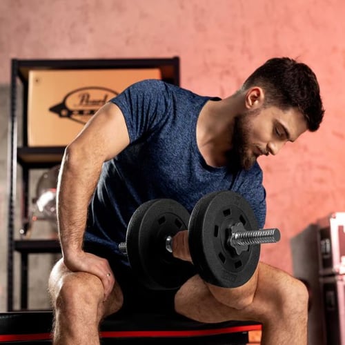 Man seated performing dumbbell bicep curls with Hop-Sport weights to support fat-burning strength training