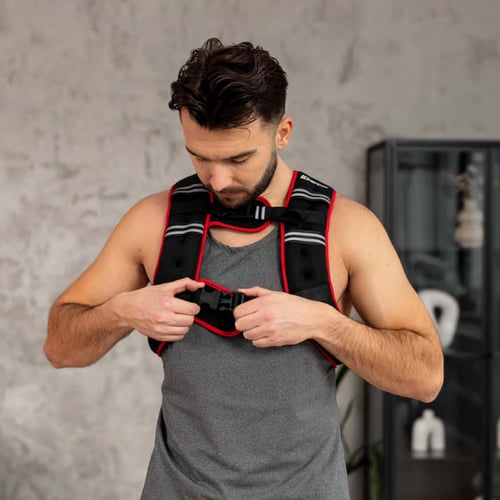 Man putting on the Weighted Vest
