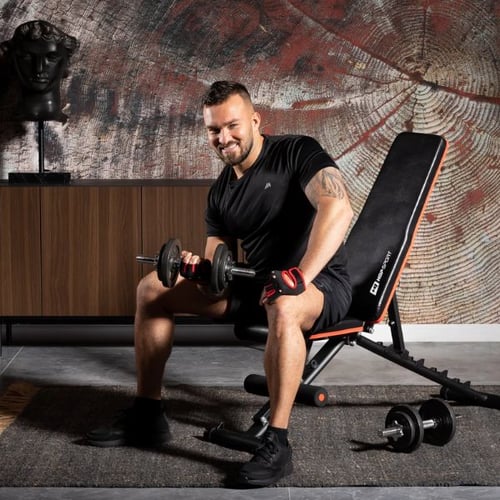 Man doing seated dumbbell curls on a Hop-Sport adjustable bench