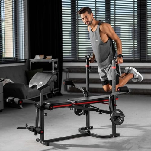 Man performing dips on a Hop-Sport home gym workout bench with integrated dip bars