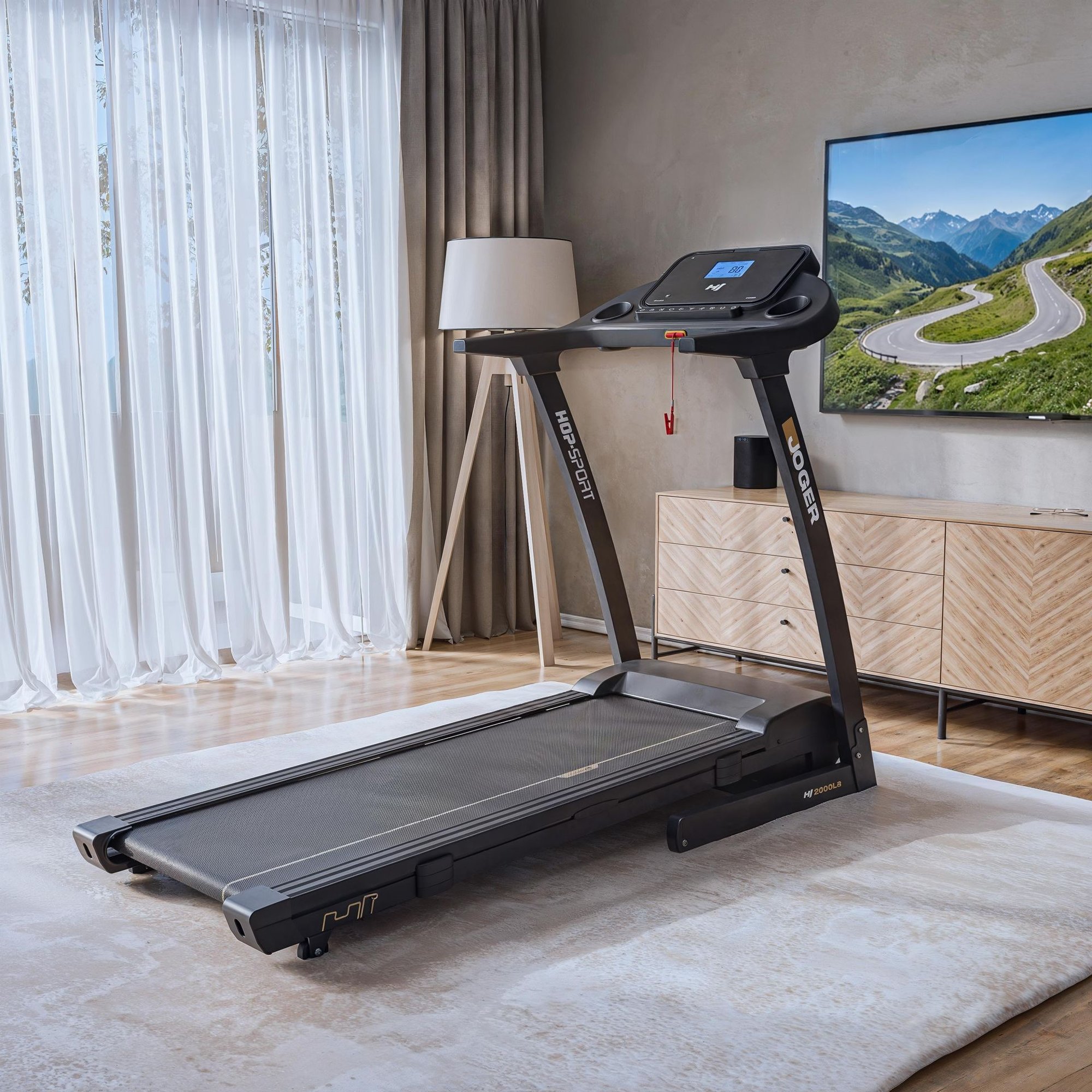 Front view of a folded black treadmill standing upright. The image highlights the slim profile of the equipment when not in use.